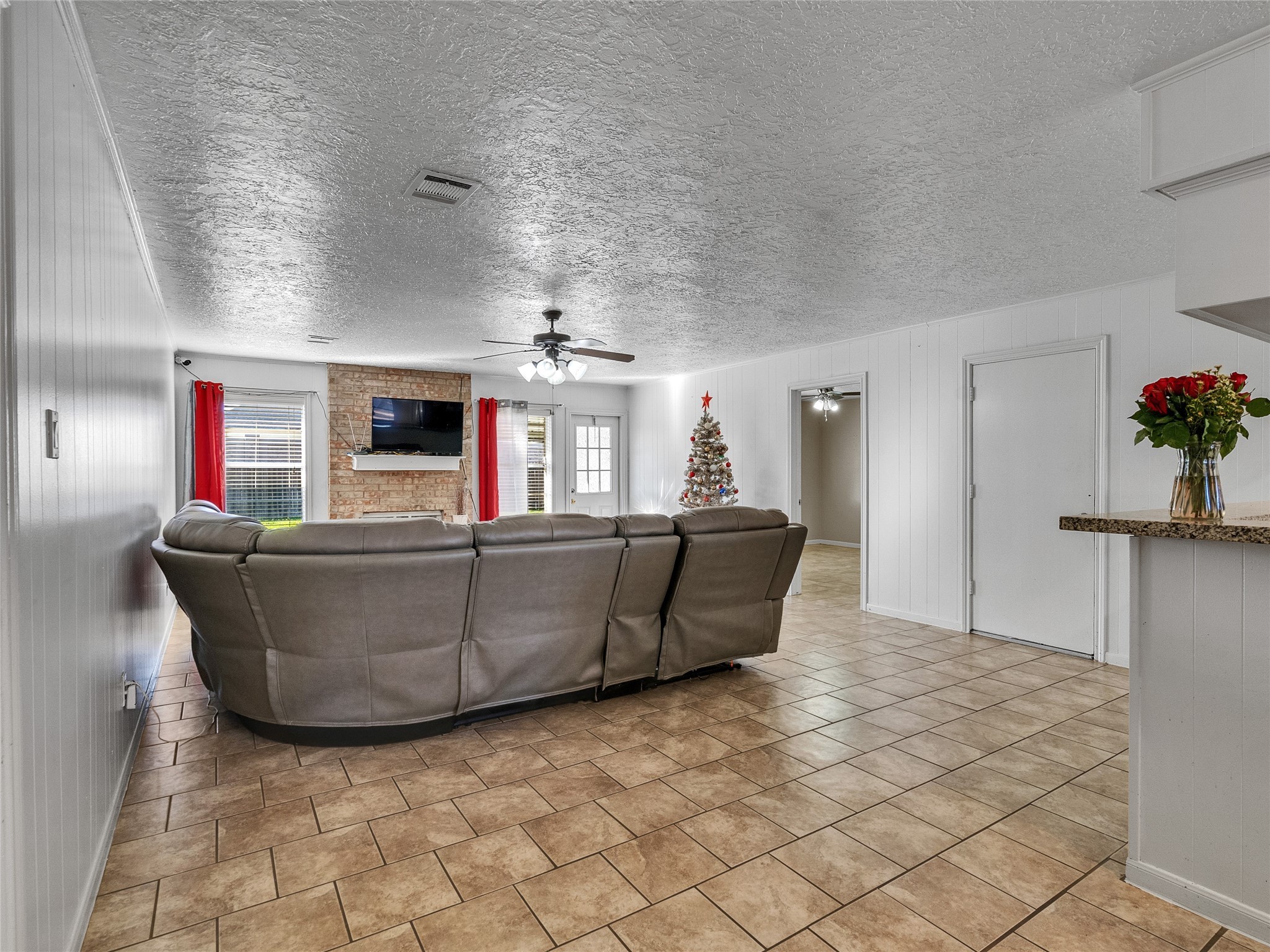 2201 Georgetown Street Katy, TX 77493 - Photo 5 of 20 a living room with furniture and a flat screen tv