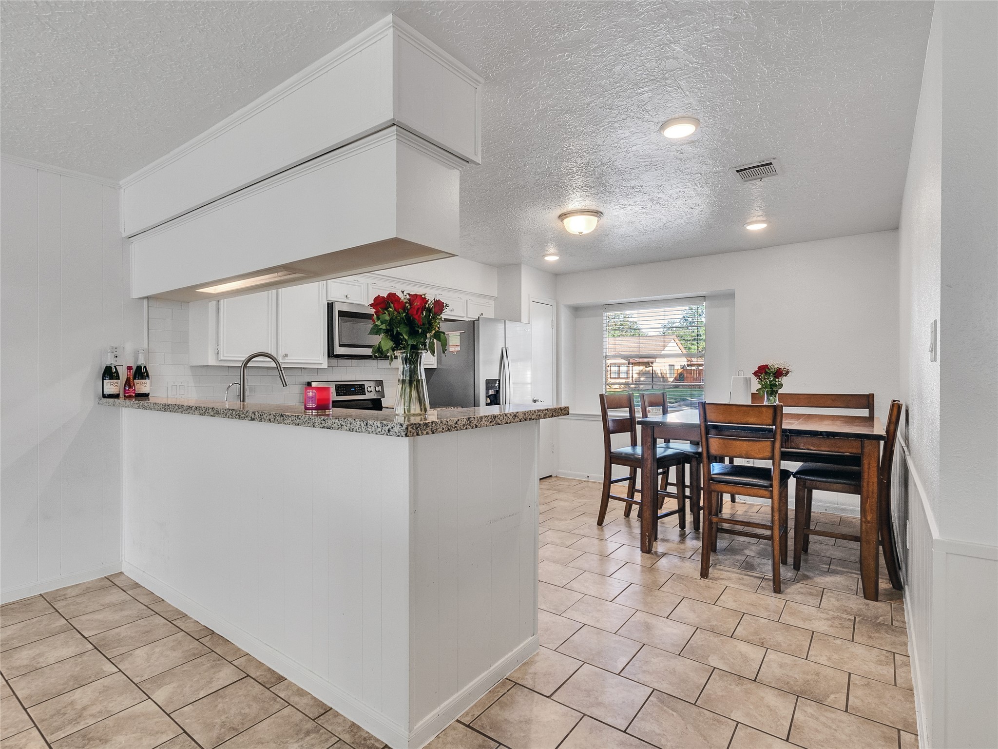 2201 Georgetown Street Katy, TX 77493 - Photo 6 of 20 a view of a dining room with furniture and a chandelier