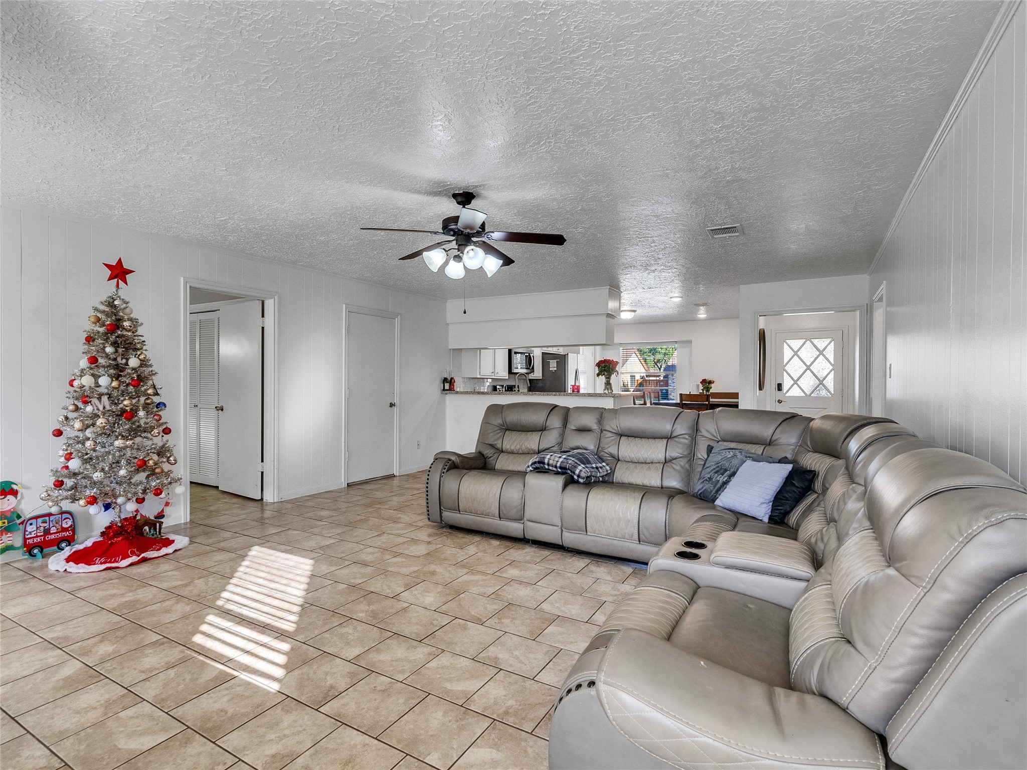 2201 Georgetown Street Katy, TX 77493 - Photo 7 of 20 a living room with furniture and a chandelier