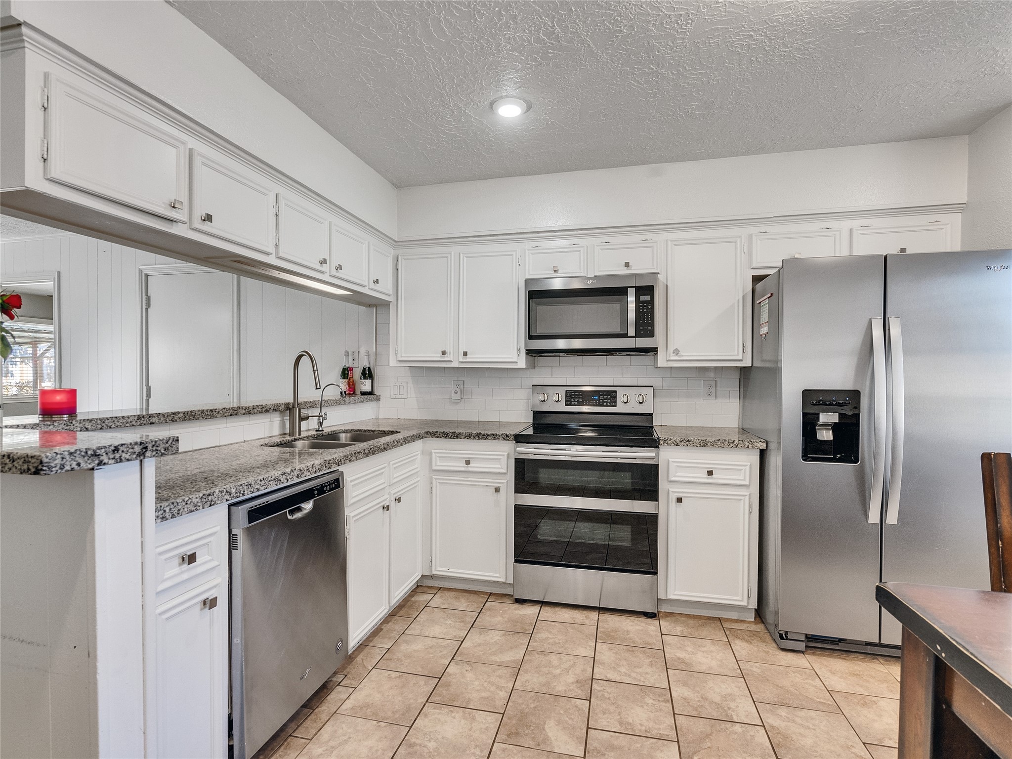 2201 Georgetown Street Katy, TX 77493 - Photo 8 of 20 a kitchen with stainless steel appliances granite countertop a refrigerator sink and stove