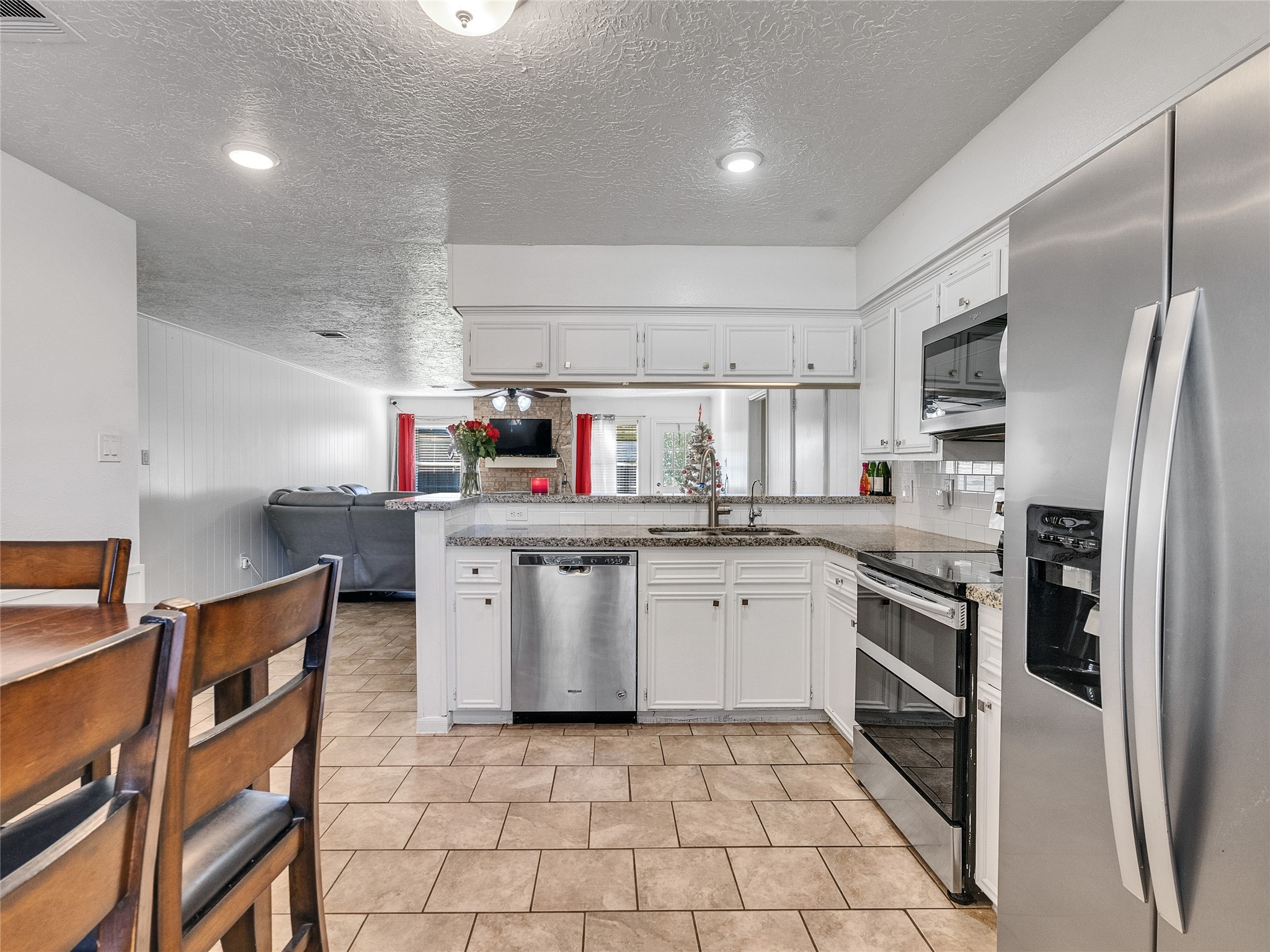 2201 Georgetown Street Katy, TX 77493 - Photo 10 of 20 a kitchen with appliances cabinets and a sink