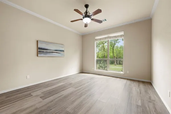 a view of a kitchen with wooden floor and a sink