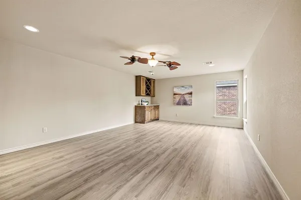 an aerial view of residential houses with yard