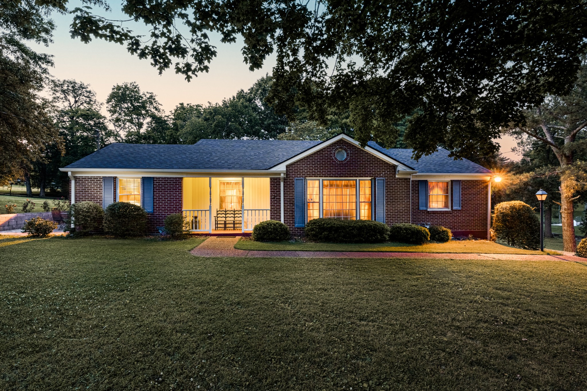 a front view of a house with a yard