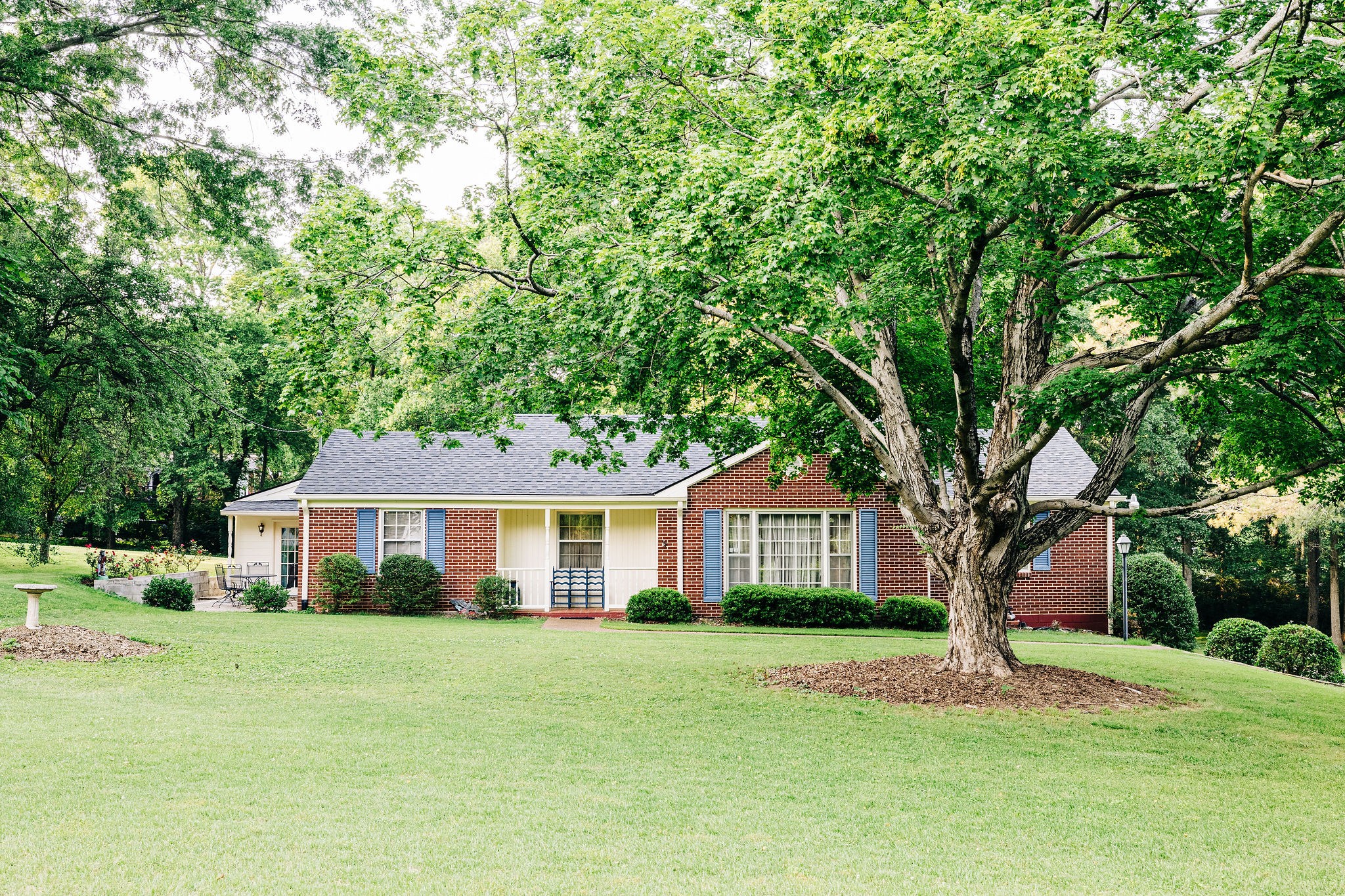 805 Vantrease Road Madison, TN 37115 - Photo 11 of 60 a front view of a house with a garden