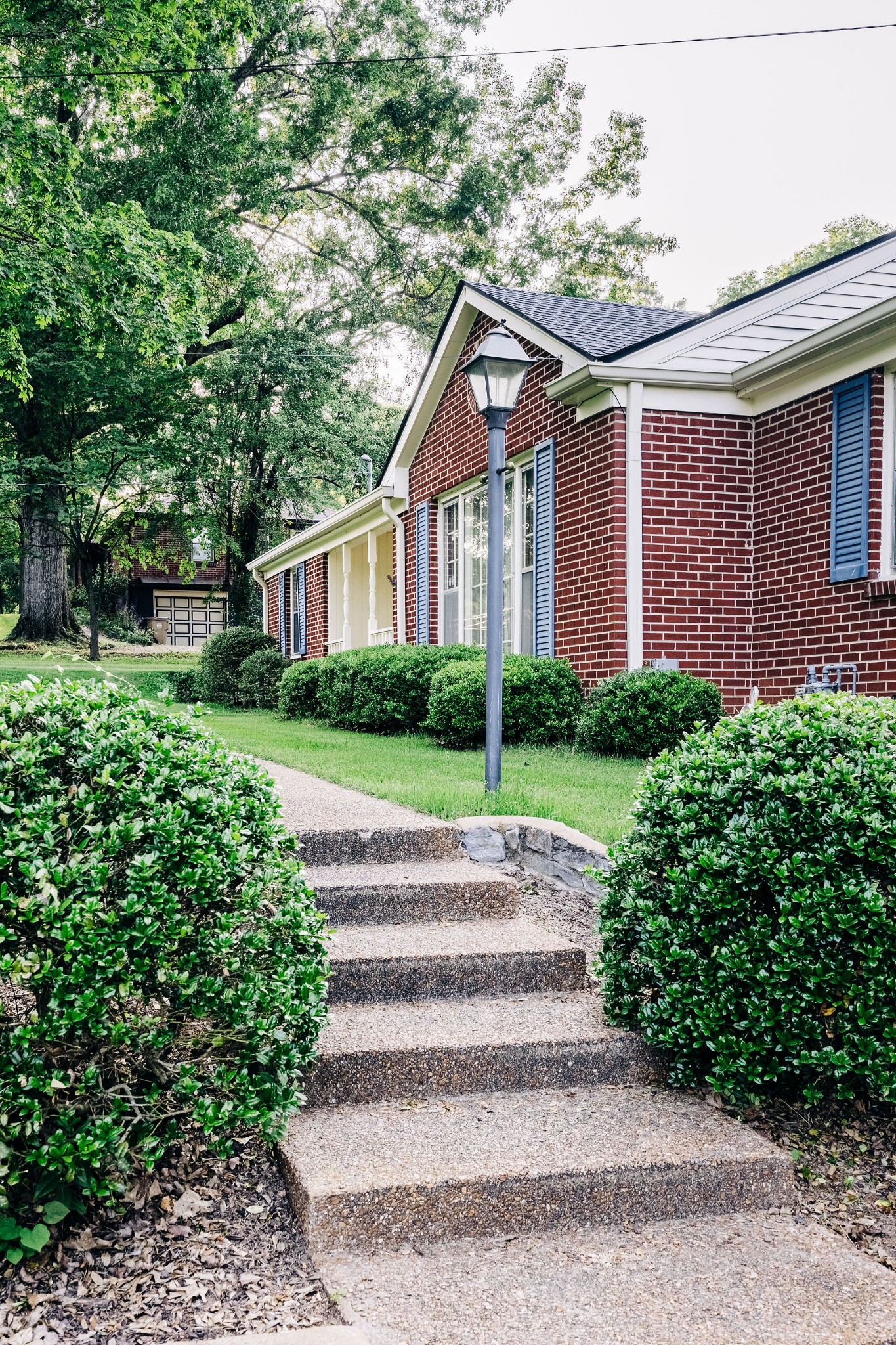 805 Vantrease Road Madison, TN 37115 - Photo 12 of 60 a front view of a house with a yard and trees