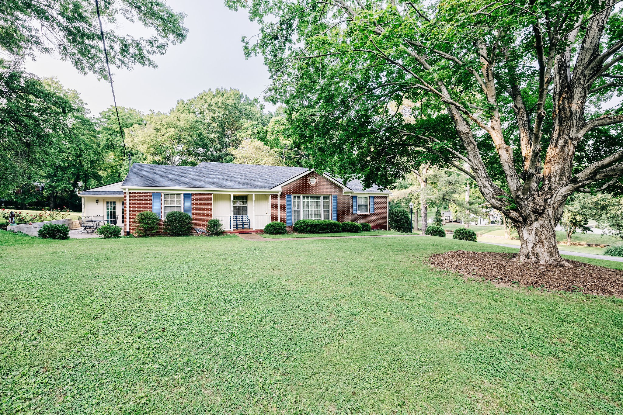 805 Vantrease Road Madison, TN 37115 - Photo 3 of 60 a front view of a house with a garden and porch