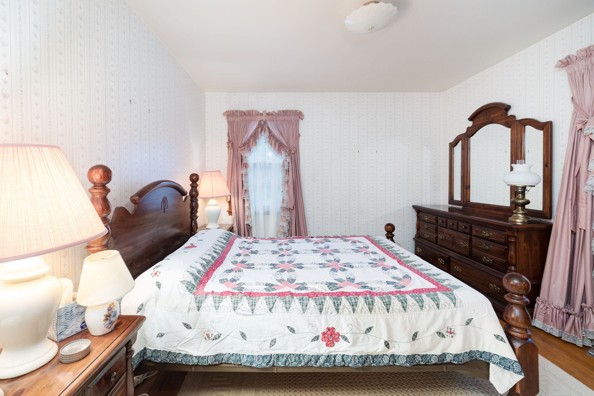 805 Vantrease Road Madison, TN 37115 - Photo 36 of 60 a bedroom with a bed and dresser with mirror