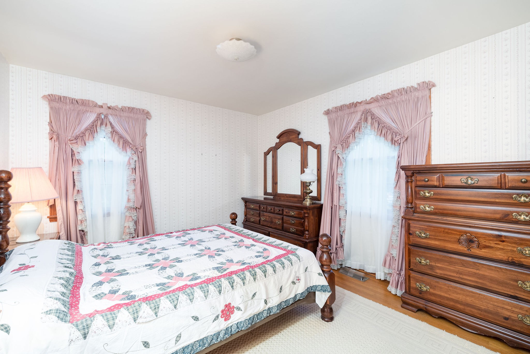 805 Vantrease Road Madison, TN 37115 - Photo 37 of 60 a bedroom with a bed and dresser with mirror