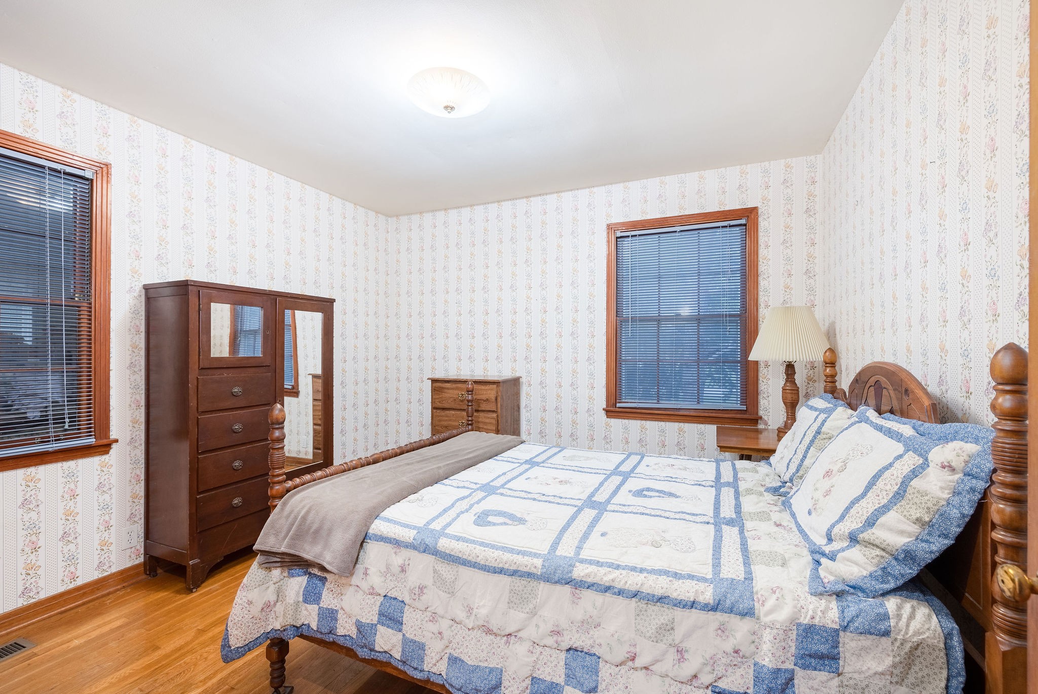 805 Vantrease Road Madison, TN 37115 - Photo 40 of 60 a bedroom with a bed and wooden floor