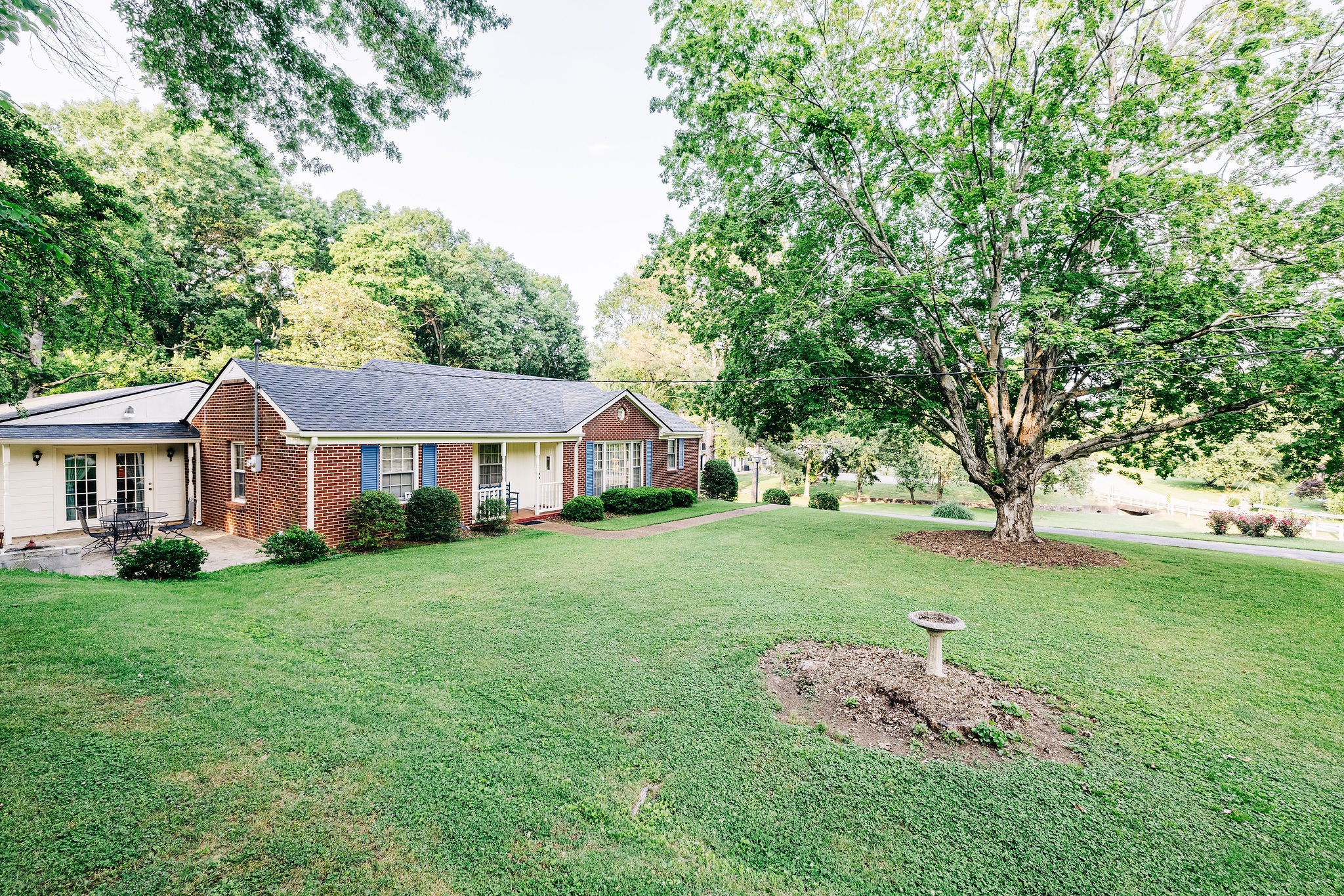 805 Vantrease Road Madison, TN 37115 - Photo 5 of 60 a front view of a house with a garden