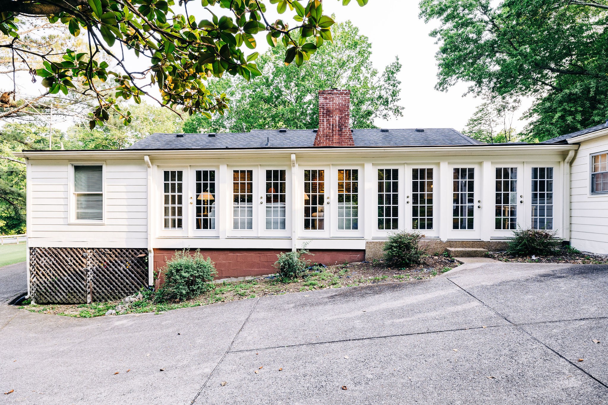 805 Vantrease Road Madison, TN 37115 - Photo 54 of 60 a front view of a house with a garden and outdoor seating
