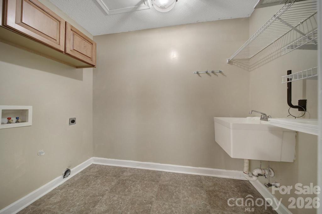 4394 Mountain Creek Road Iron Station, NC 28080 - Photo 13 of 45 a bathroom with a sink and a mirror