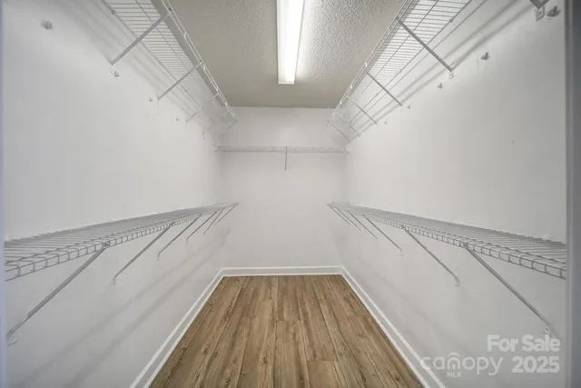 a view of a room with racks on the wall