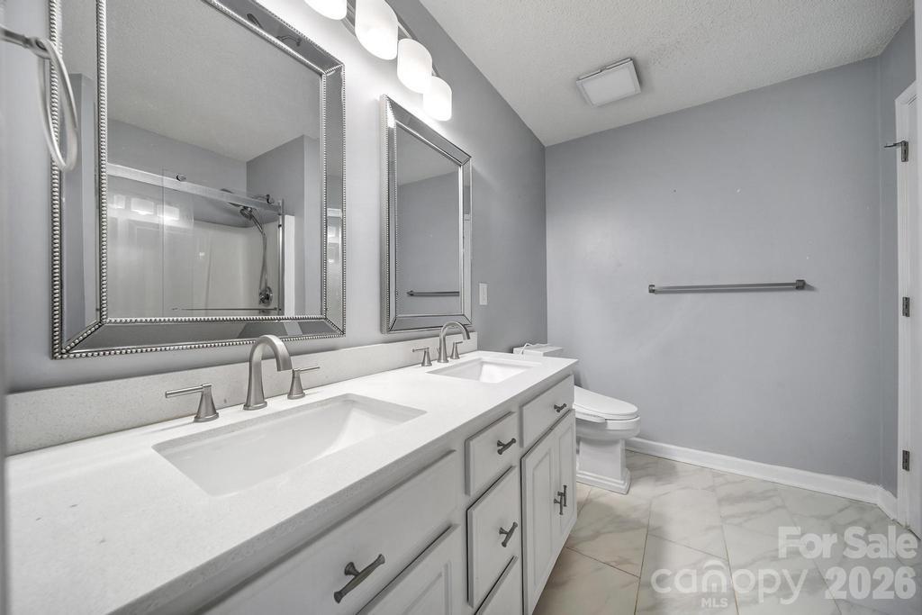 4394 Mountain Creek Road Iron Station, NC 28080 - Photo 22 of 45 a bathroom with a sink and a mirror