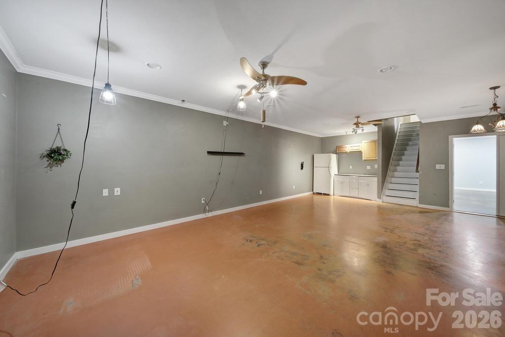 4394 Mountain Creek Road Iron Station, NC 28080 - Photo 29 of 45 a view of an empty room with a ceiling fan
