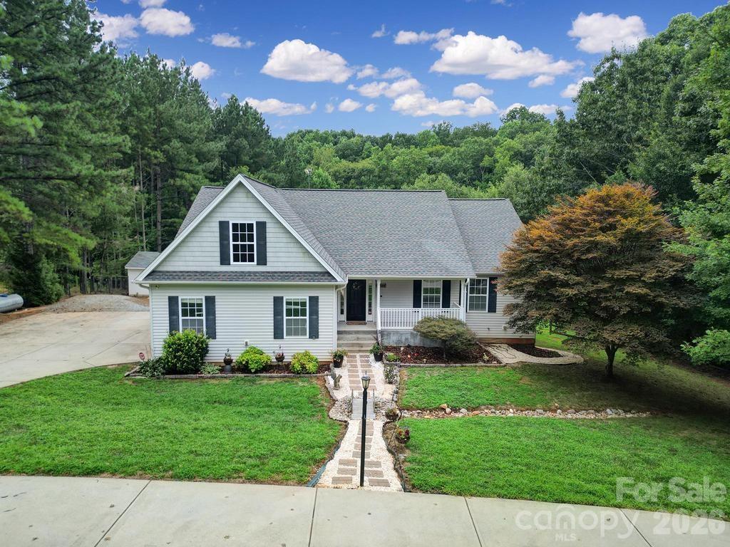4394 Mountain Creek Road Iron Station, NC 28080 - Photo 3 of 45 a view of a house with a yard