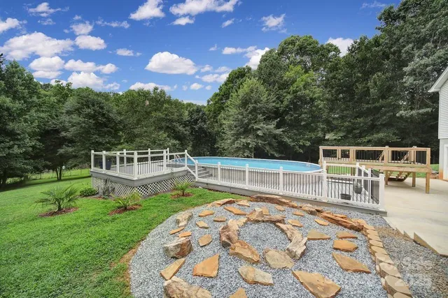 a view of a house with backyard porch and sitting area