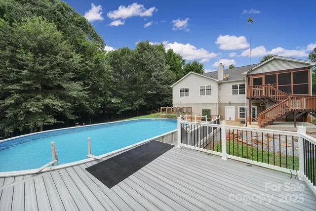 a view of a house with wooden deck