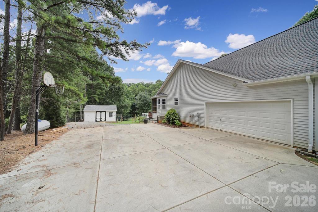 4394 Mountain Creek Road Iron Station, NC 28080 - Photo 39 of 45 a view of a house with a outdoor space