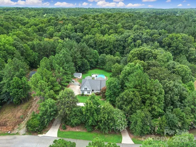 a view of a back yard from a garden