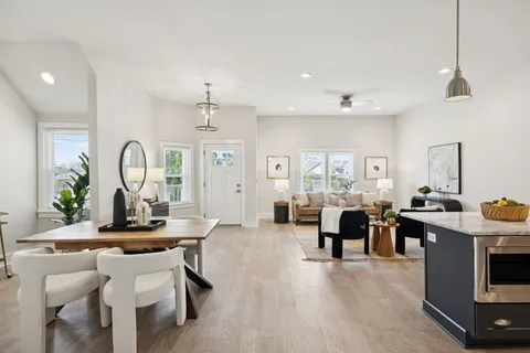 a kitchen with a stove a sink and a microwave