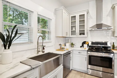 a bathroom with a toilet and a bath tub
