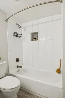 a living room with furniture and windows