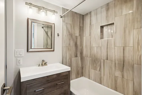 a bed room with two bed and a couch