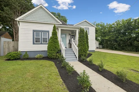 a front view of a house with garden