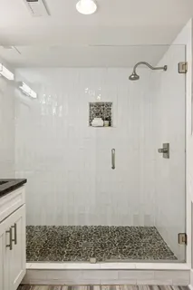 a backyard of a house with lots of plants and tree