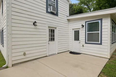 an aerial view of a house with yard swimming pool and outdoor seating