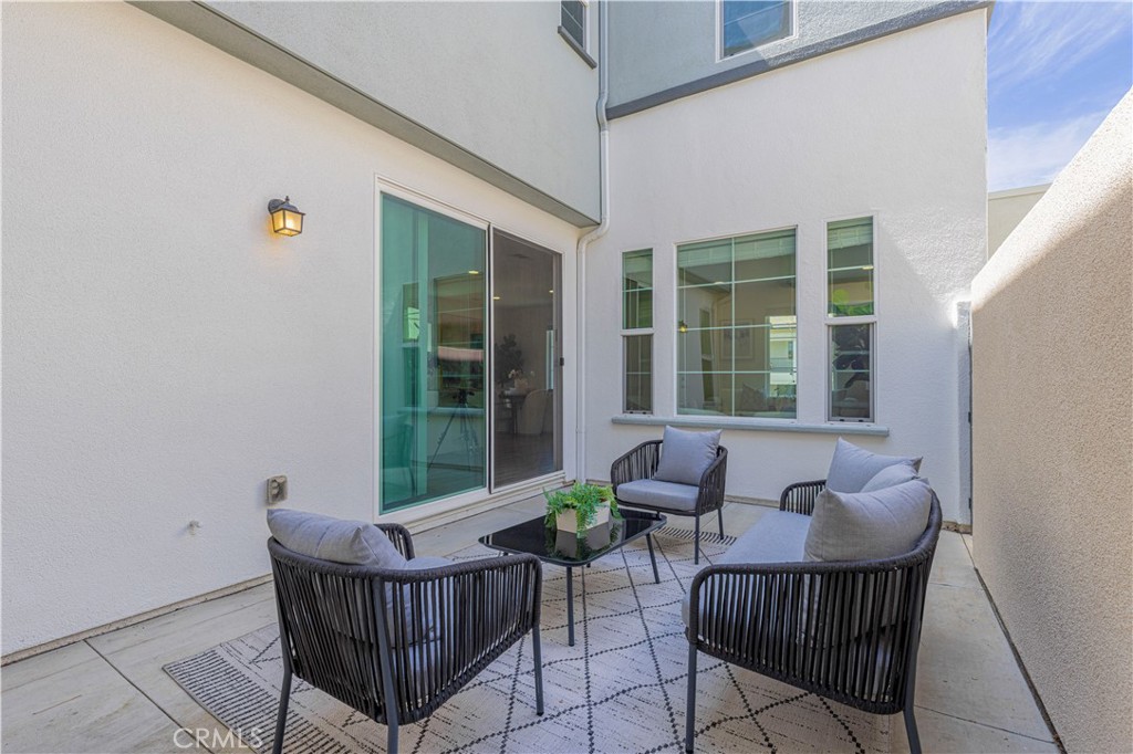 202 Cultivate Irvine, CA 92618 - Photo 13 of 65 a view of a chair and table in the balcony