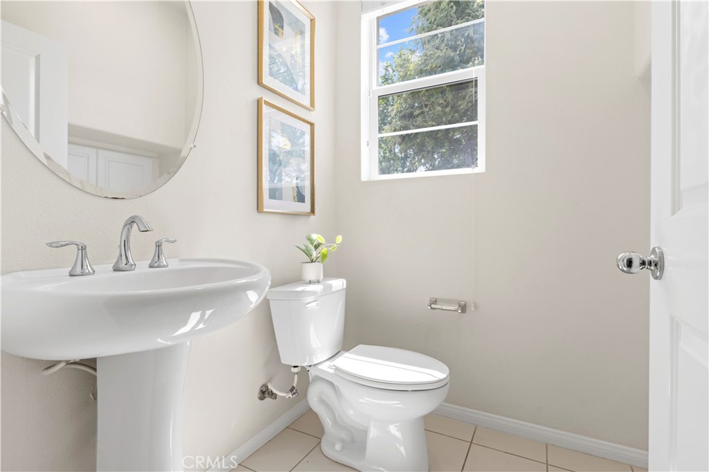 202 Cultivate Irvine, CA 92618 - Photo 23 of 65 a bathroom with a toilet a sink and a mirror