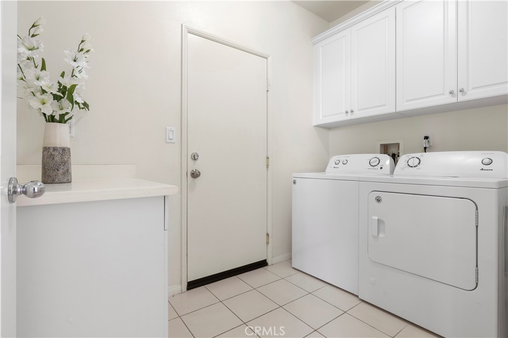 202 Cultivate Irvine, CA 92618 - Photo 24 of 65 a view of storage and utility room with washer and dryer
