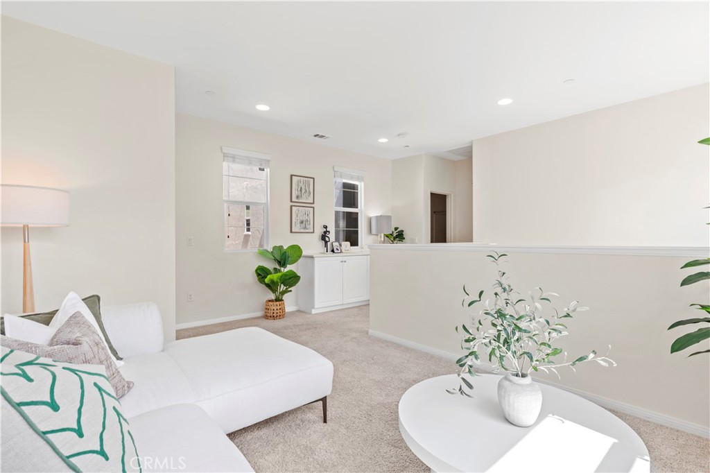 202 Cultivate Irvine, CA 92618 - Photo 31 of 65 a living room with furniture potted plant and white walls