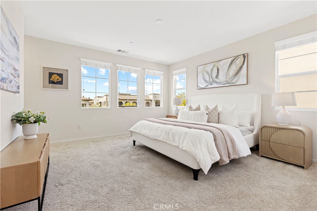 202 Cultivate Irvine, CA 92618 - Photo 33 of 65 a spacious bedroom with a bed and a couch