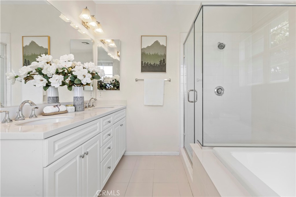 202 Cultivate Irvine, CA 92618 - Photo 37 of 65 a bathroom with a double vanity sink mirror and shower