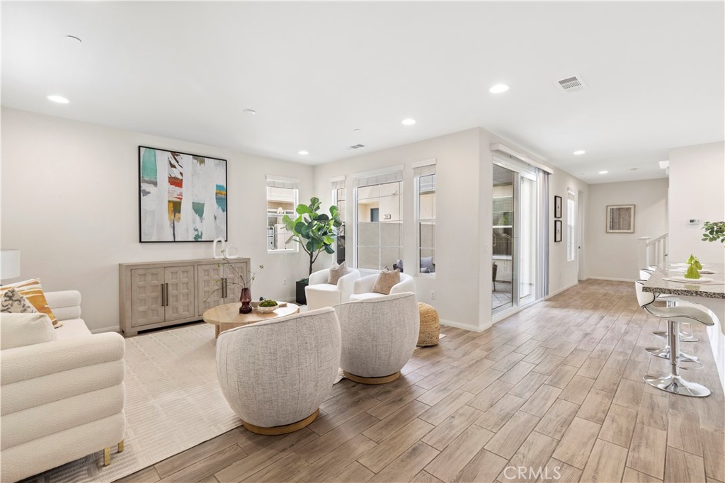 202 Cultivate Irvine, CA 92618 - Photo 40 of 65 a living room with furniture and a wooden floor