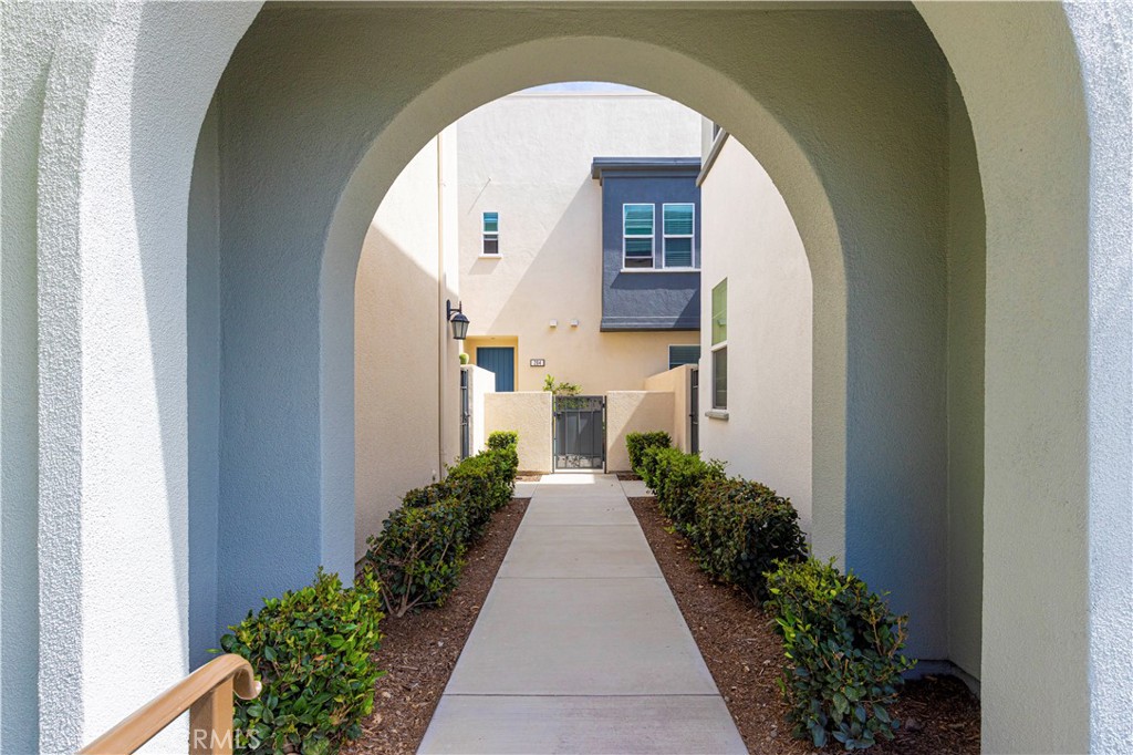 202 Cultivate Irvine, CA 92618 - Photo 41 of 65 a view of a pathway of a house with potted plants