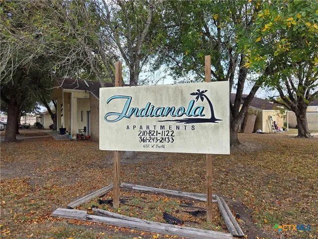 a sign that is on the side of a road