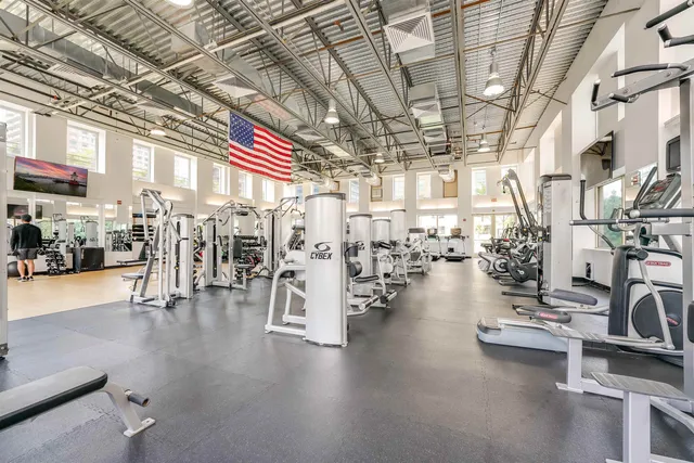 a view of a room with lots of wooden furniture