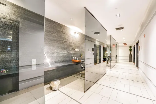 a lobby with a couch and a rug