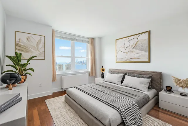 a bedroom with a bed and a window