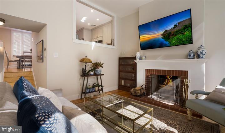 508 Addison Street Philadelphia, PA 19147 - Photo 5 of 14 a living room with furniture and a fireplace
