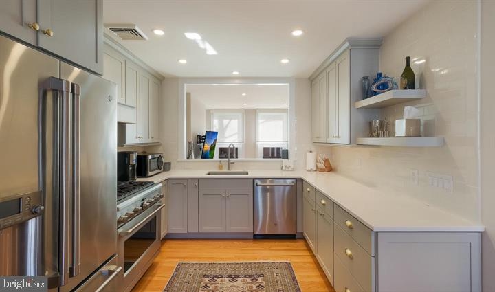 508 Addison Street Philadelphia, PA 19147 - Photo 8 of 14 a kitchen with a sink stove and refrigerator