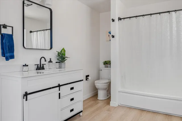 a bathroom with a sink vanity and a mirror