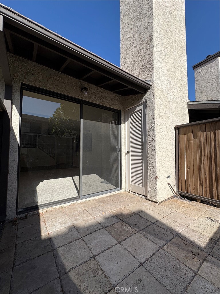 18223 Soledad Canyon Road, Unit 29 Canyon Country, CA 91387 - Photo 18 of 23 a backyard of a house with wooden floor