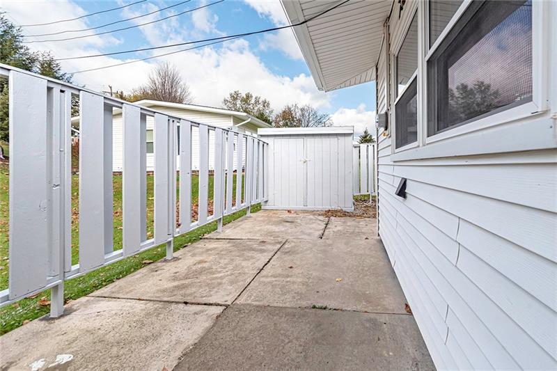 115 Nike Road Coraopolis, PA 15108 - Photo 19 of 25 Front patio with privacy fence that wraps around the side of house.