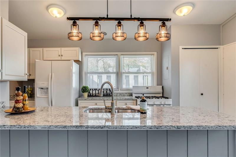 115 Nike Road Coraopolis, PA 15108 - Photo 9 of 25 Newly updated kitchen with industrial style lighting and granite countertops.